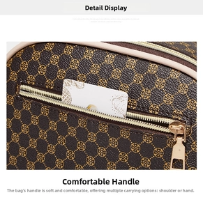 Detail of exterior zipper pocket on brown printed handbag with gold clover pattern