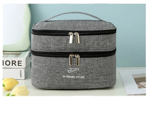 Close-up of double-layer travel toiletry bag with grey marl texture and sturdy handle