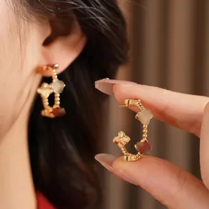18k gold plated C-shaped hoop earrings with clover floral motifs and zircon inlay