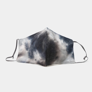Detailed view of the blue and white tie-dye face mask with adjustable ear straps