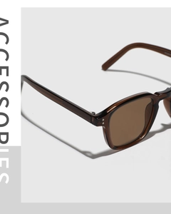 Detailed macro view of the tortoiseshell square frame and hinges on retro sunglasses