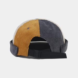 Detail of adjustable buckle on corduroy miki hat with color-blocking design
