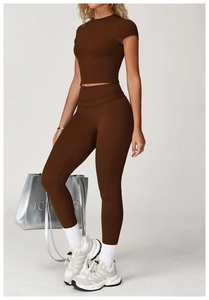 Detailed view of chocolate brown yoga set with cropped short sleeve top and leggings