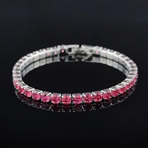 Close-up of tennis bracelet with pink round-cut cubic zirconia in silver four-claw setting