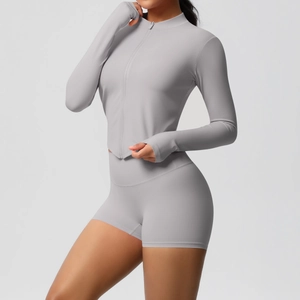 Detailed view of the thumbholes and stretchy fabric on a gray yoga jacket set
