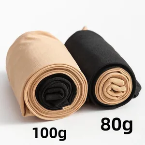 Detail of high-elastic stitching tights in nude and black colors with weight markings