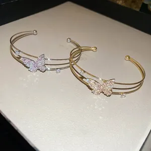 Double-layered butterfly open bangles with pink and white cubic zirconia crystals