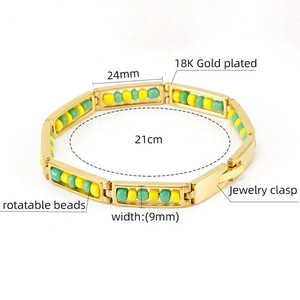 Detail view of 18K gold plated bracelet with rotatable beads and jewelry clasp