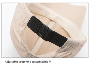 Close-up of adjustable elastic buckle and breathable mesh fabric on the beige baseball cap