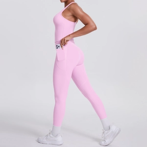 Detailed side view of pink high-waisted yoga leggings with practical side phone pockets