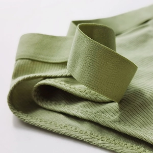 Green rib-knit cotton thong with wide elastic waistband and seamless stitching details