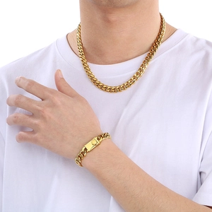 Men gold-plated stainless steel Miami Cuban link chain necklace and bracelet on male model