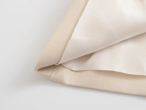 Close-up of beige slimming tube top fabric texture and high-quality lining detail