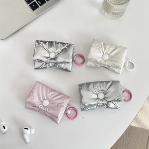 Quilted puffer style AirPods case with bow texture detail in silver white pink and grey
