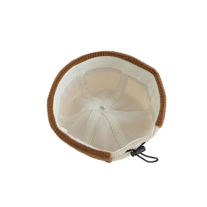 Kids corduroy docker hat with letter C and adjustable drawstring interior details
