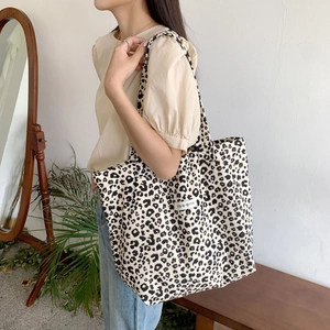 Close-up of leopard print canvas tote bag showing large capacity and stylish fabric detail