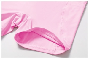 Detail of pink yoga shorts with professional flatlock stitching and high elastic fabric