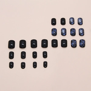 Deep blue and black snowflake press-on nails with galaxy pattern, medium-long square shape