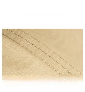 Close-up of khaki quick-dry baseball cap with durable double stitching and twill texture