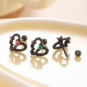 Black heart-shaped titanium steel ear studs with red and green teardrop crystals