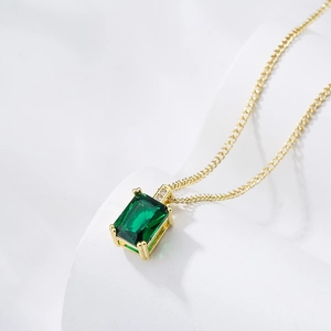Elegant 18K gold plated necklace with rectangular green zircon pendant on white background