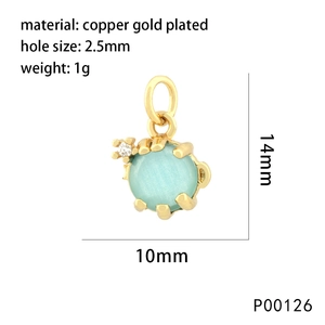 Detailed view of seahorse pendant in copper gold plating with light blue gemstone