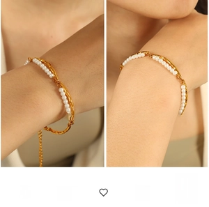Close-up of double-layer gold plated bracelet with white pearls and adjustable chain