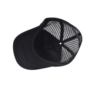 Detailed view of the mesh structure and inner seams of a black trucker cap