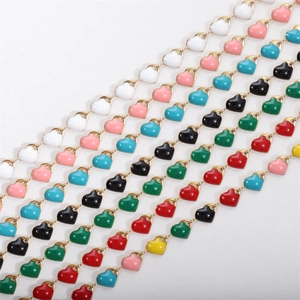Multi-colored 18k gold plated stainless steel heart charm bracelets set on white