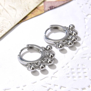 Retro silver geometric metal hoop earrings with round bead tassels in a minimalist style