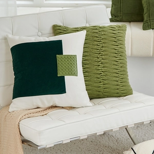 Nordic decorative throw pillows featuring geometric patchwork and olive green pleated texture