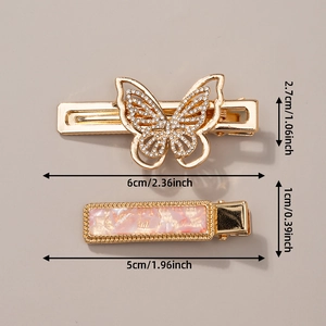 Detail of turquoise and rhinestone butterfly hair clips with precise size measurements