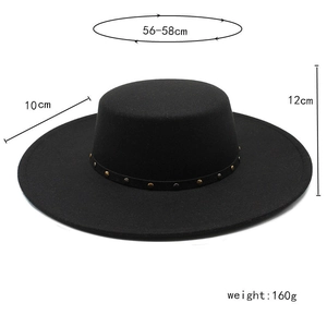 Detail of black wool fedora featuring 10cm wide brim and studded leather band decor