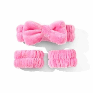 Soft pink coral fleece set with a bow headband and matching wristbands for face washing