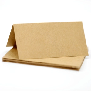 Foldable brown kraft paper place cards for wedding seating or name labeling at events