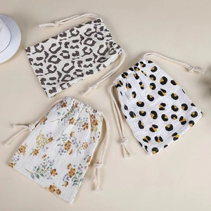 Three-piece muslin cotton drawstring storage bags with leopard, dot, and floral prints
