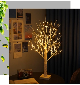 Detail of warm white LED birch tree lamp branches with natural bark texture