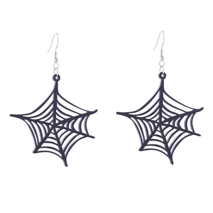 Close-up of black spider web earrings with intricate cutout details for Halloween