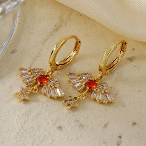 Golden hoop earrings with red heart gems, angel wings and dangling diamond star charms