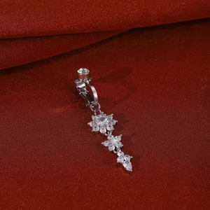 Detailed view of silver clip-on belly ring with zircon flower and dangling teardrop gems