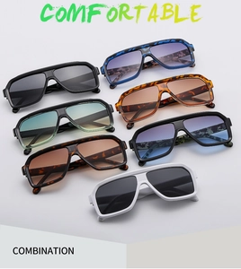 Collection of oversized retro sunglasses in black, white, and marble patterns