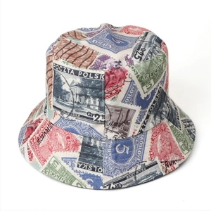 Detailed close-up of retro stamp print patterns on a double-sided bucket sun hat