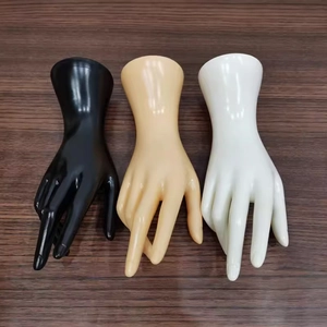 Detailed view of hand display models in black, beige, and white for rings and jewelry