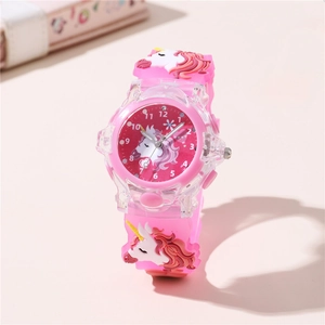 Close-up of pink unicorn watch face with white Arabic numerals and 3D silicone strap details