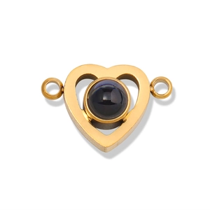 Detailed view of heart-shaped gold connector with black projection stone for bracelets