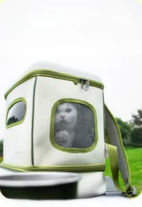 Detail showing breathable mesh window and cream canvas material of the pet carrier