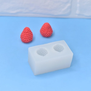 Detailed macro view of 2-cavity silicone mold with realistic strawberry texture