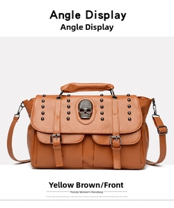 Detailed front view of brown rocker handbag with metal skull and rivet decorations