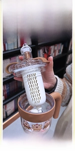 Detail of Kapibara water bottle showing the handle and built-in tea infuser filter
