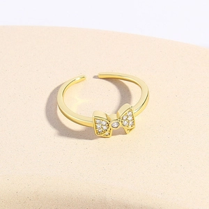 Minimalist 18k gold plated copper bow ring with sparkling zircons and adjustable open band